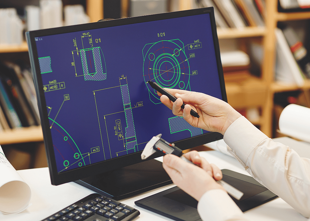 An engineer designing a new product using CAD.