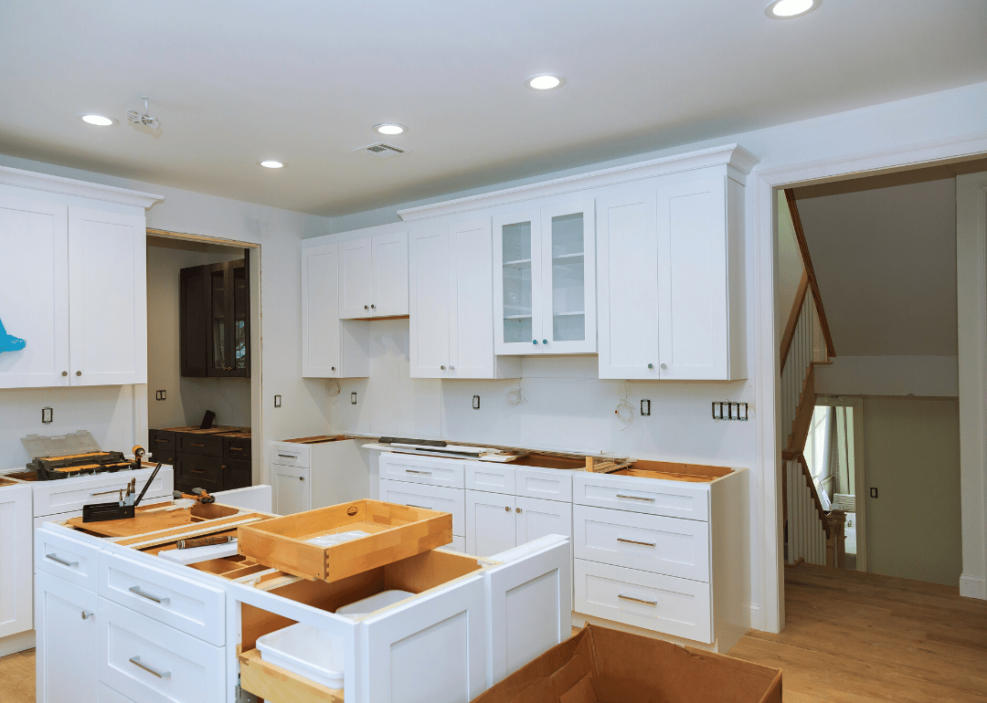 Furniture being installed during a kitchen renovation.