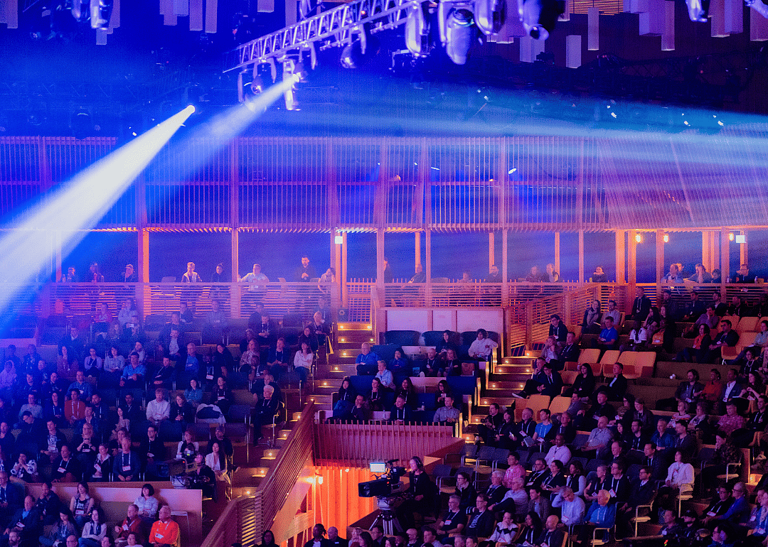 Attendees reacting to a talk in the TED Theater at TED 2019.