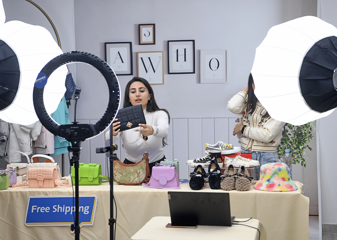 A livestreamer selling handbags via TikTok