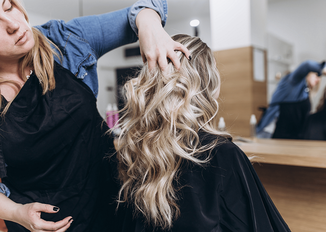 A hair dresser working in a salon.