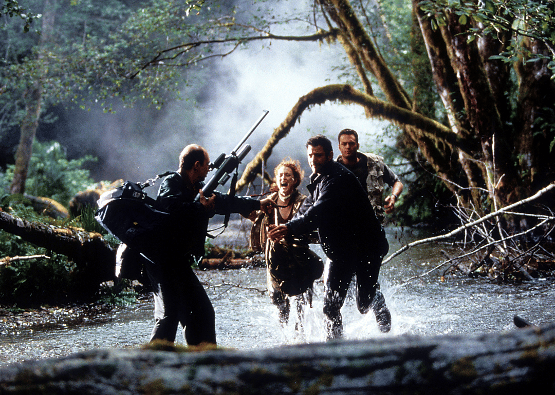 Jeff Goldblum, Julianne Moore, and Vince Vaughn running through water trying to escape danger in The Lost World: Jurassic Park