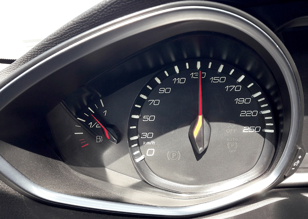 A car's spedometer which reads 130 miles per hour