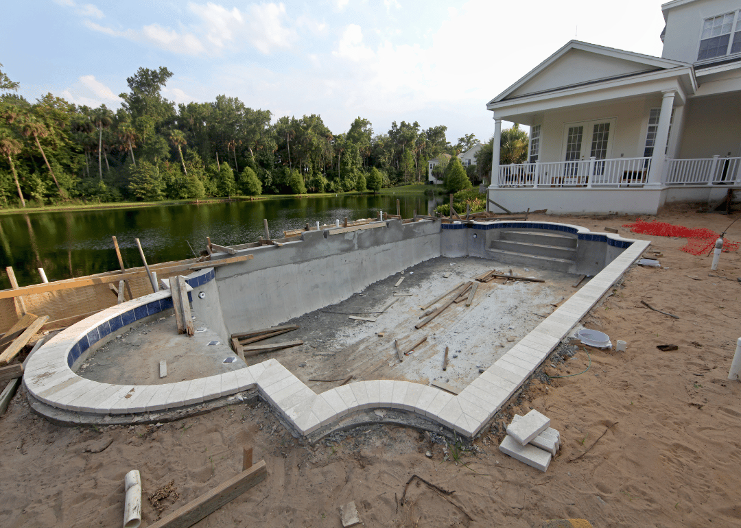 A residential swimming pool under construction in a Florida backyard..
