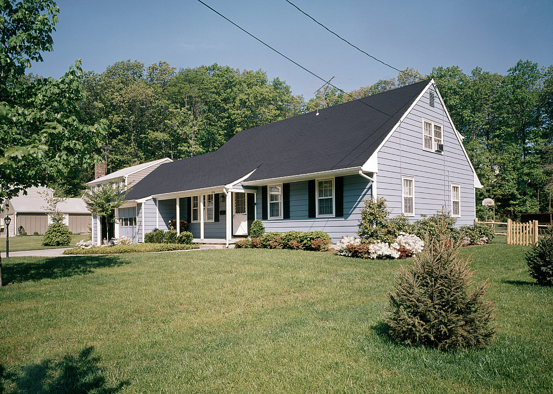 A blue home with black shutters in 1971.