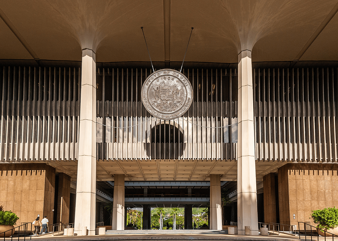 The Bronze Seal of State of Hawaii hanging from ceiling above entrance to State Capitol in Honolulu.