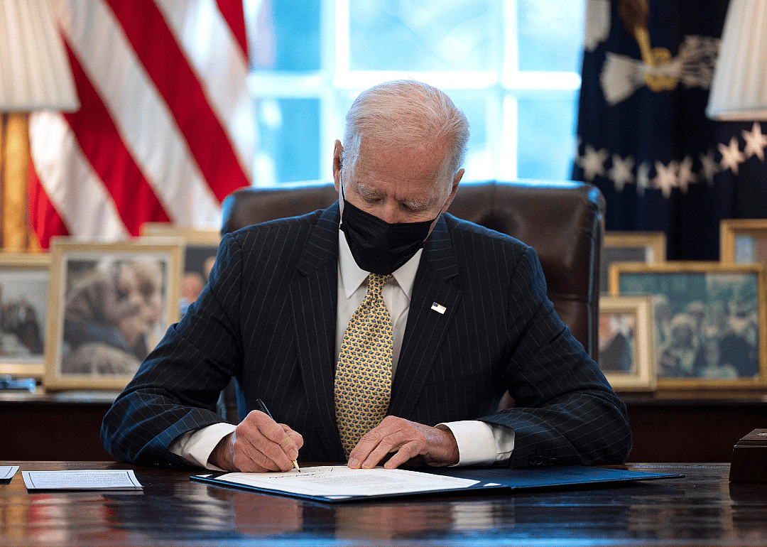 President Joe Biden signing the Paycheck Protection Program Extension Act of 2021 into law.