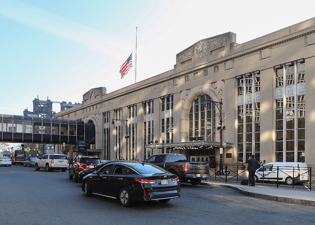 Cars and people outside the entrance to Newark Penn station in Newark, New Jersey