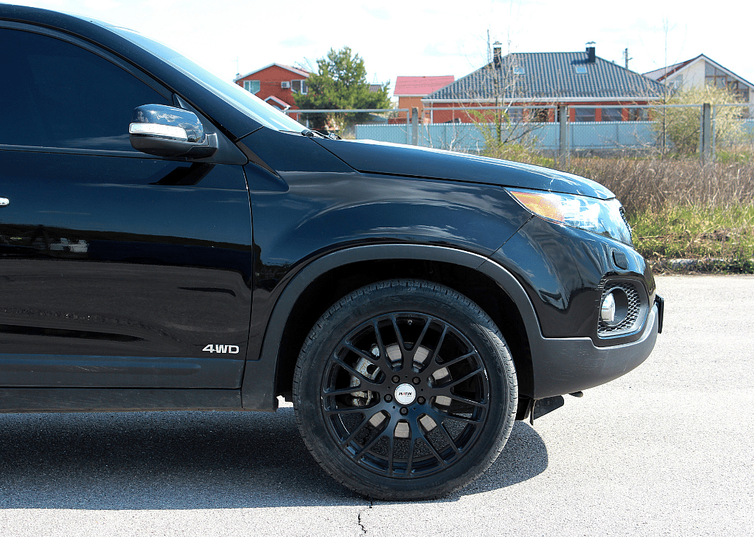 A black SUV manufactured in 2010
