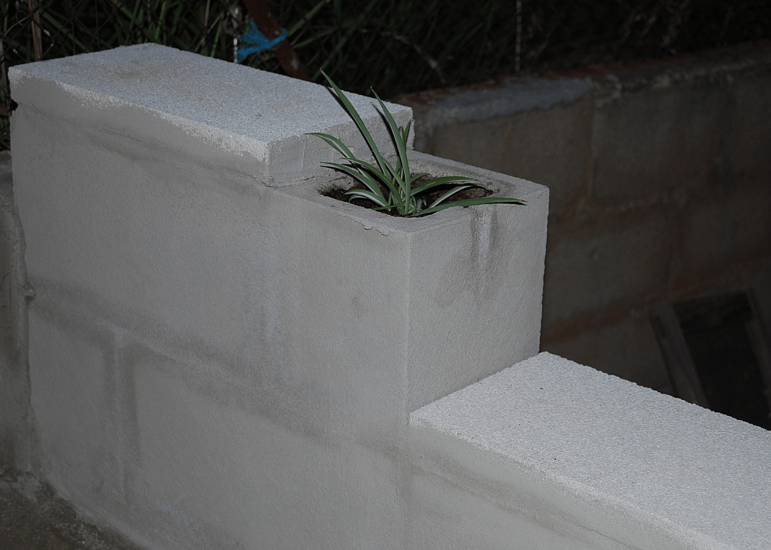 A cinder block planter with storage