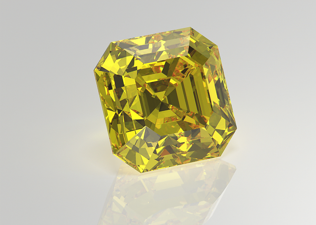 A close up of a yellow clear stone.