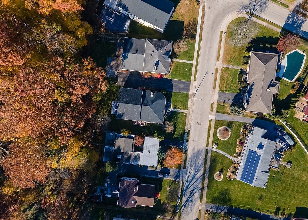 Aerial top down view of suburban multifamily homes in suburban Ardmore, Pennsylvania.