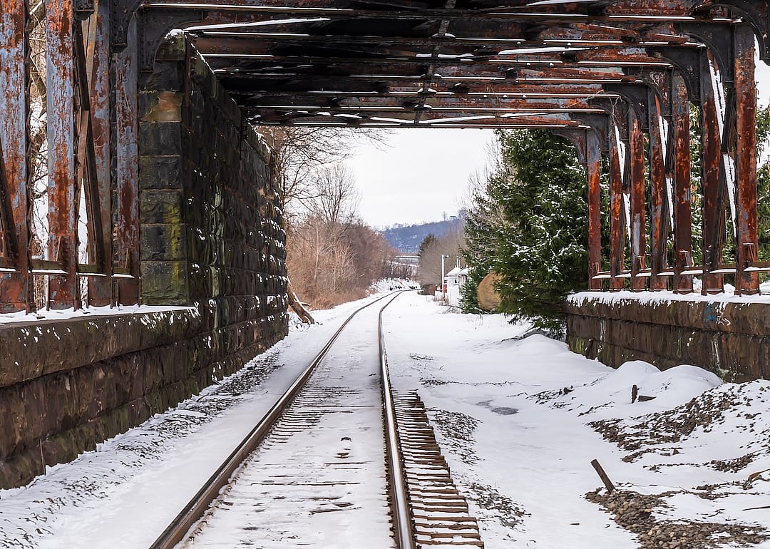 A train tunnel with snow covered train tracks on a winter day in Aspinwall, Pennsylvania.