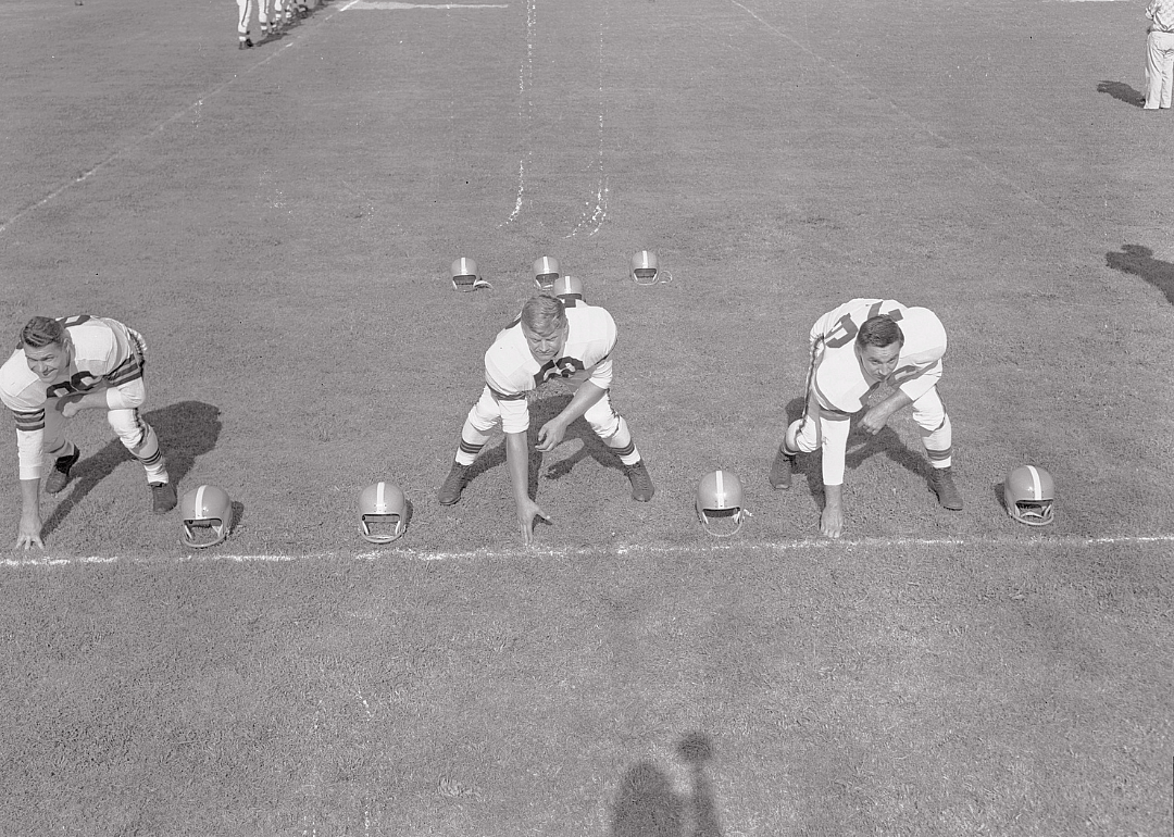 At their positions in training camp, O. Dante Lavelli, right end; Frank Gatski, center; and Lou Groza, left tackle, 1946.