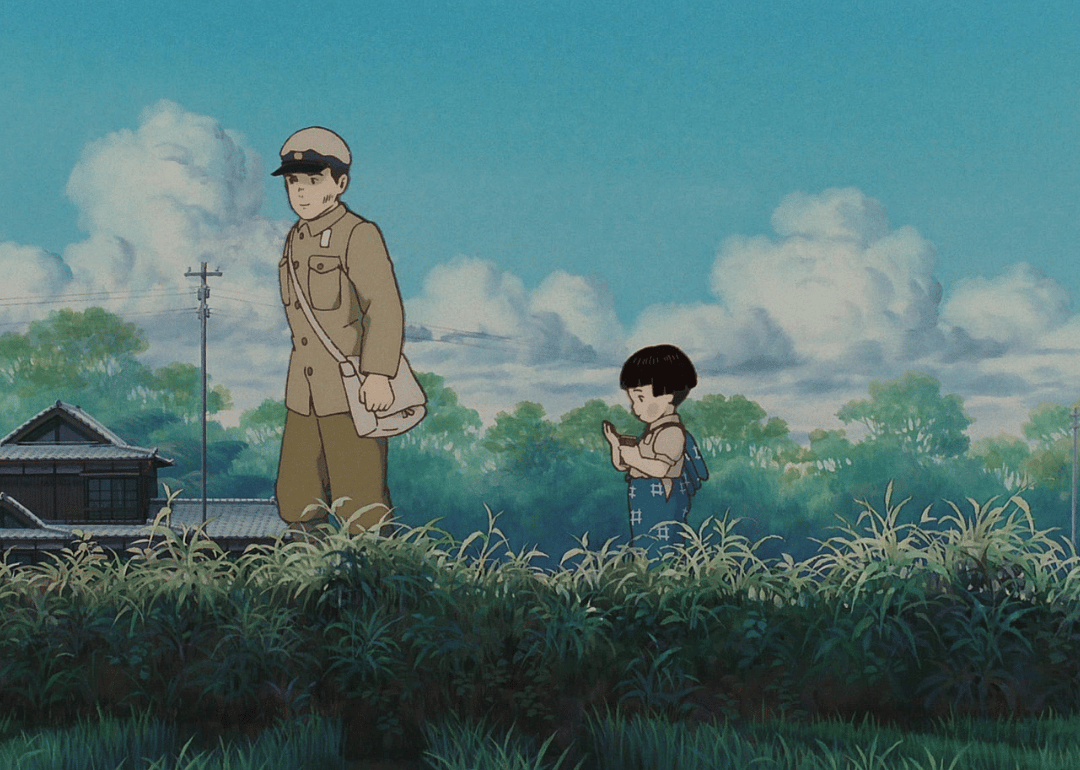A man in uniform with a baby walking behind him.