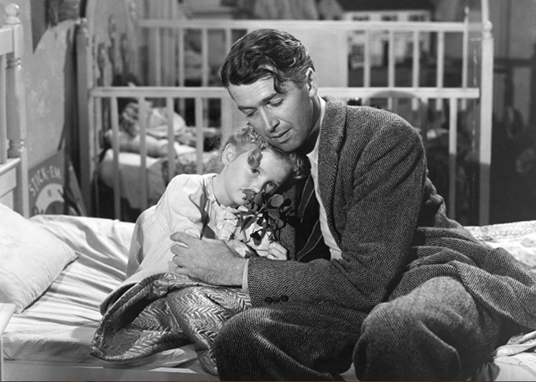 James Stewart hugging a little girl.