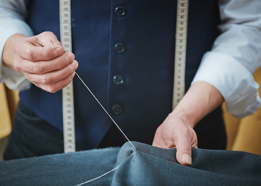 Hand sewer works on a garment