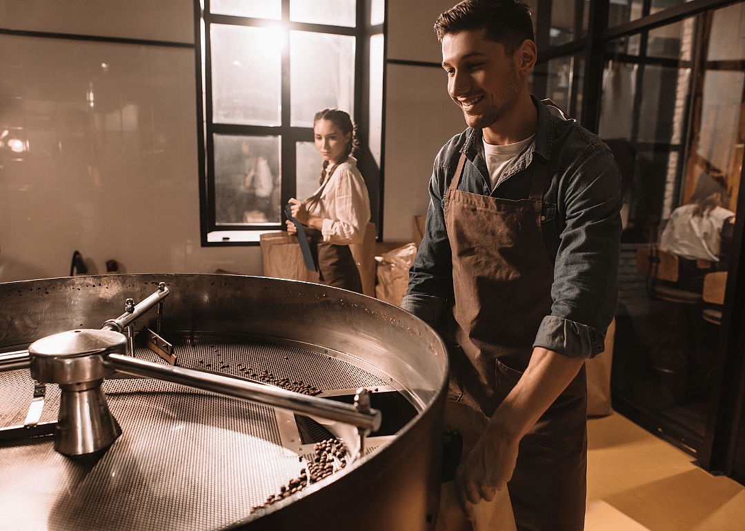 An operator of a coffee roasting machine