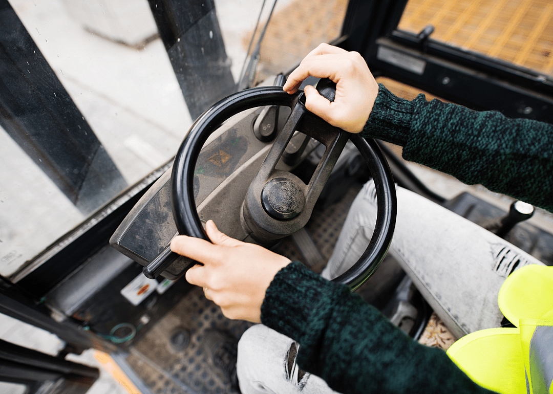 Worker drives an industrial vehicle