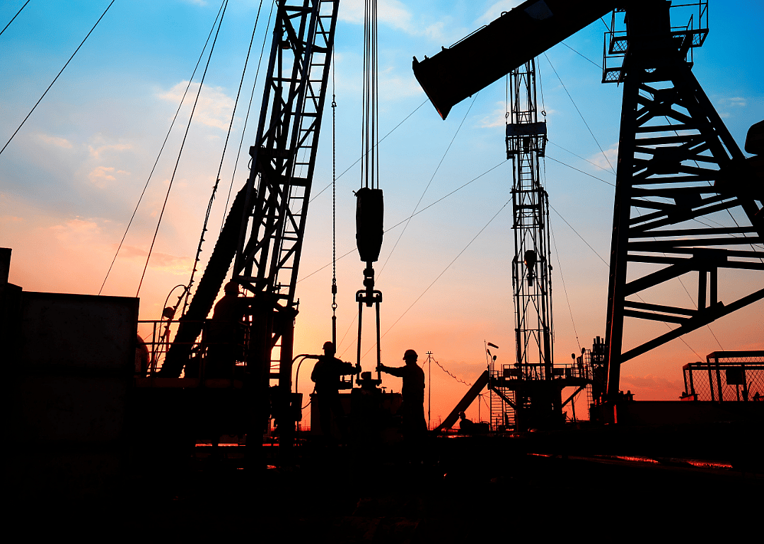 Roustabouts work at an oil drill