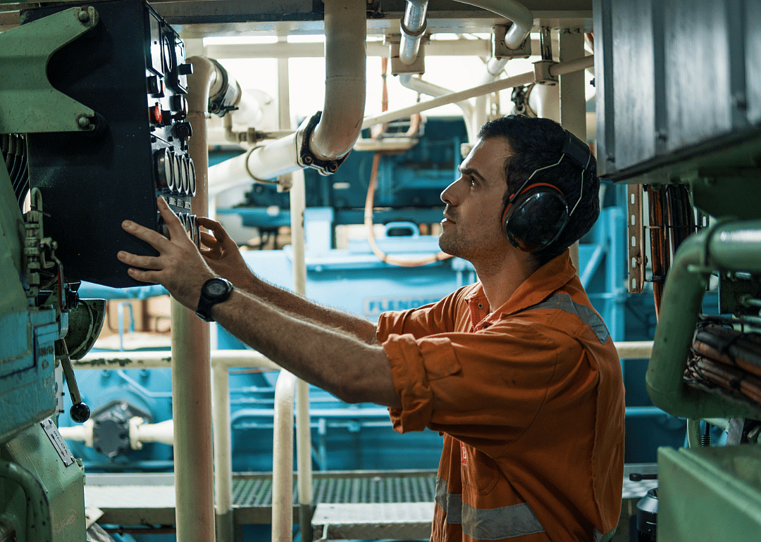 Worker in ship's engine room