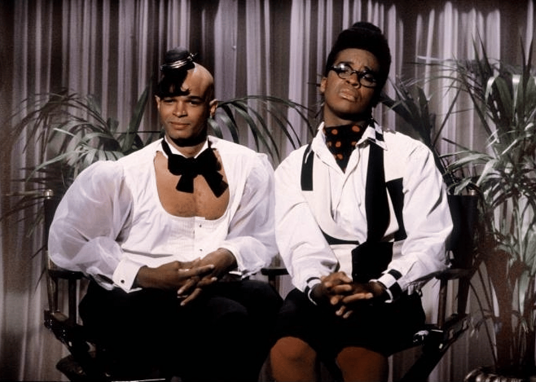 Keenen Ivory Wayans and David Alan Grier onstage in black and white costumes.