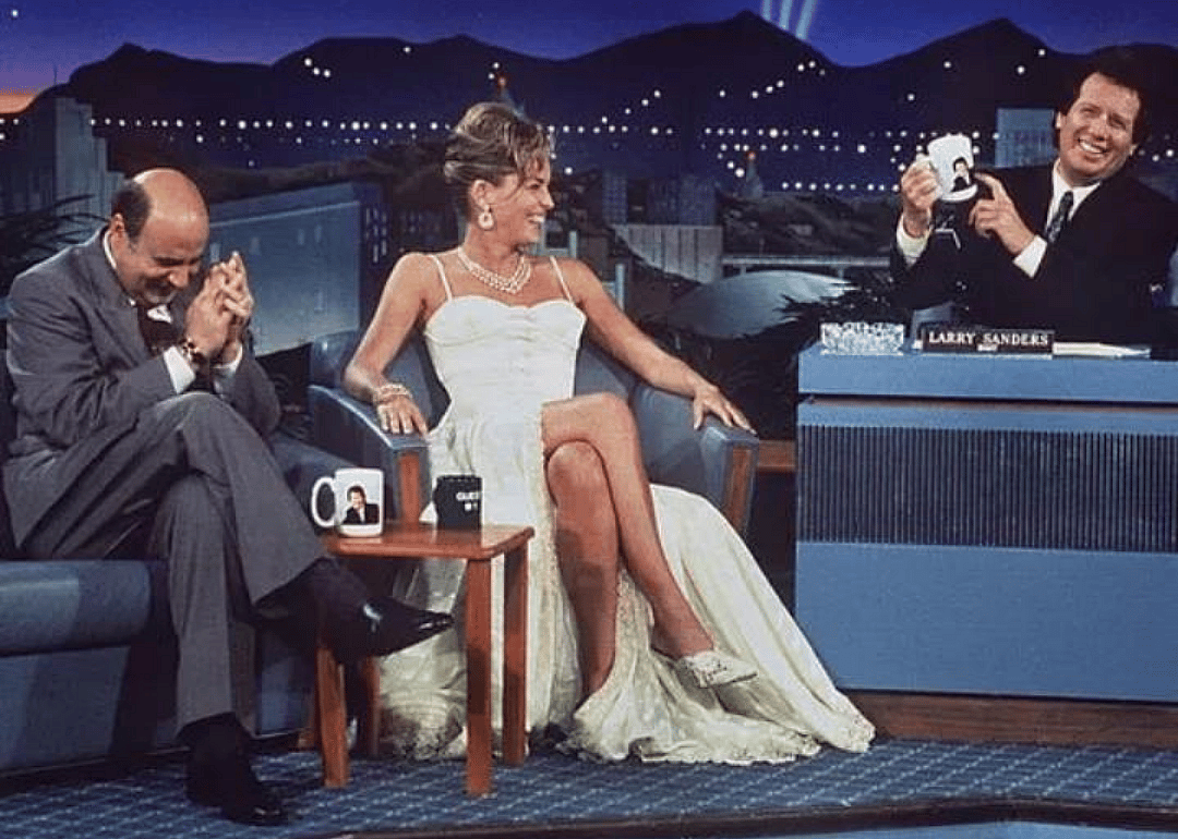 Larry Sanders and two guests on his show laughing.