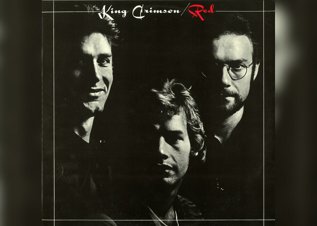 Black cover with images of each band member in white.