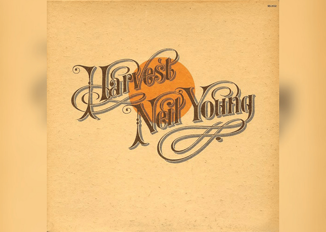 Tan cover with an orange moon behind the album and artist name.