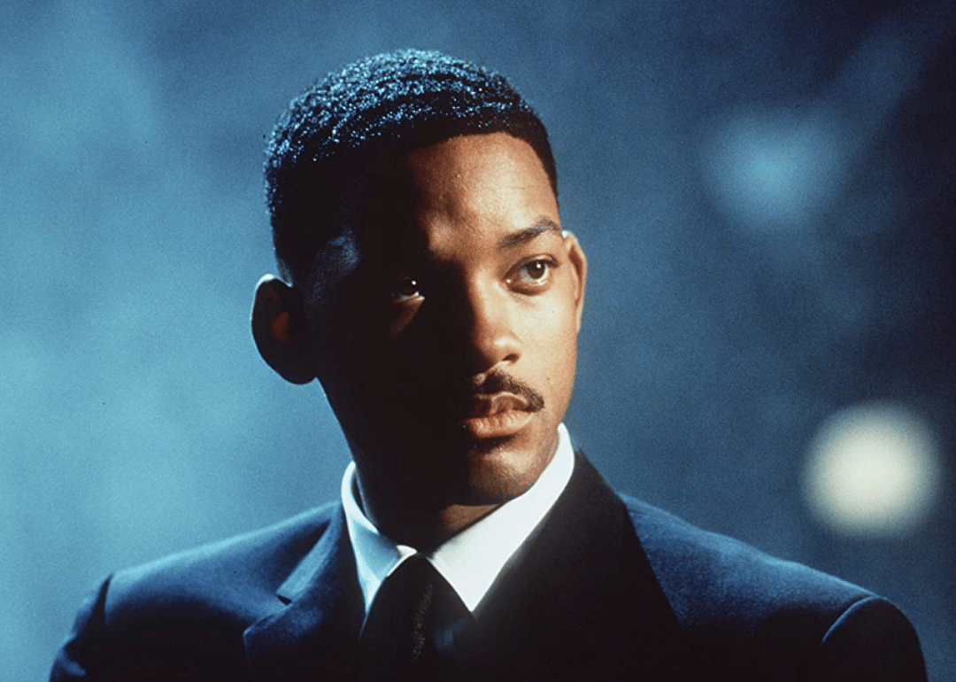 Will Smith in a black suit and tie.