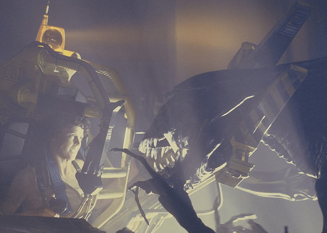 Sigourney Weaver in a metal suit battling a giant alien.