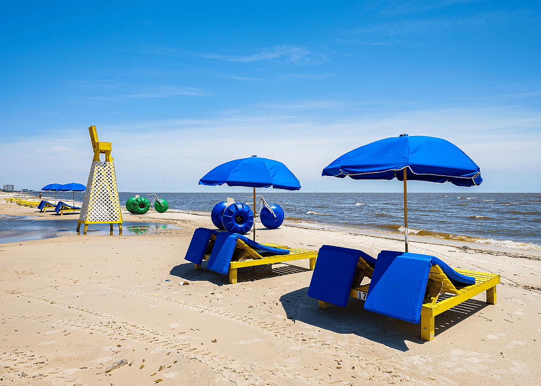 Umbrella and loungers on beach.