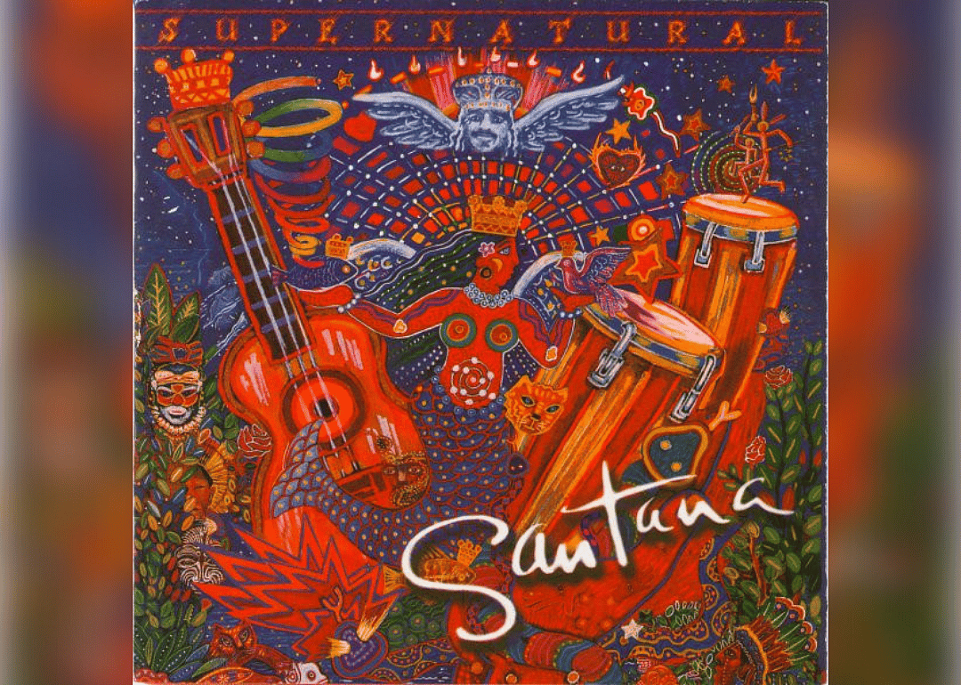 A colorful painting of a mermaid surrounded by drums, a guitar and tribal motif.