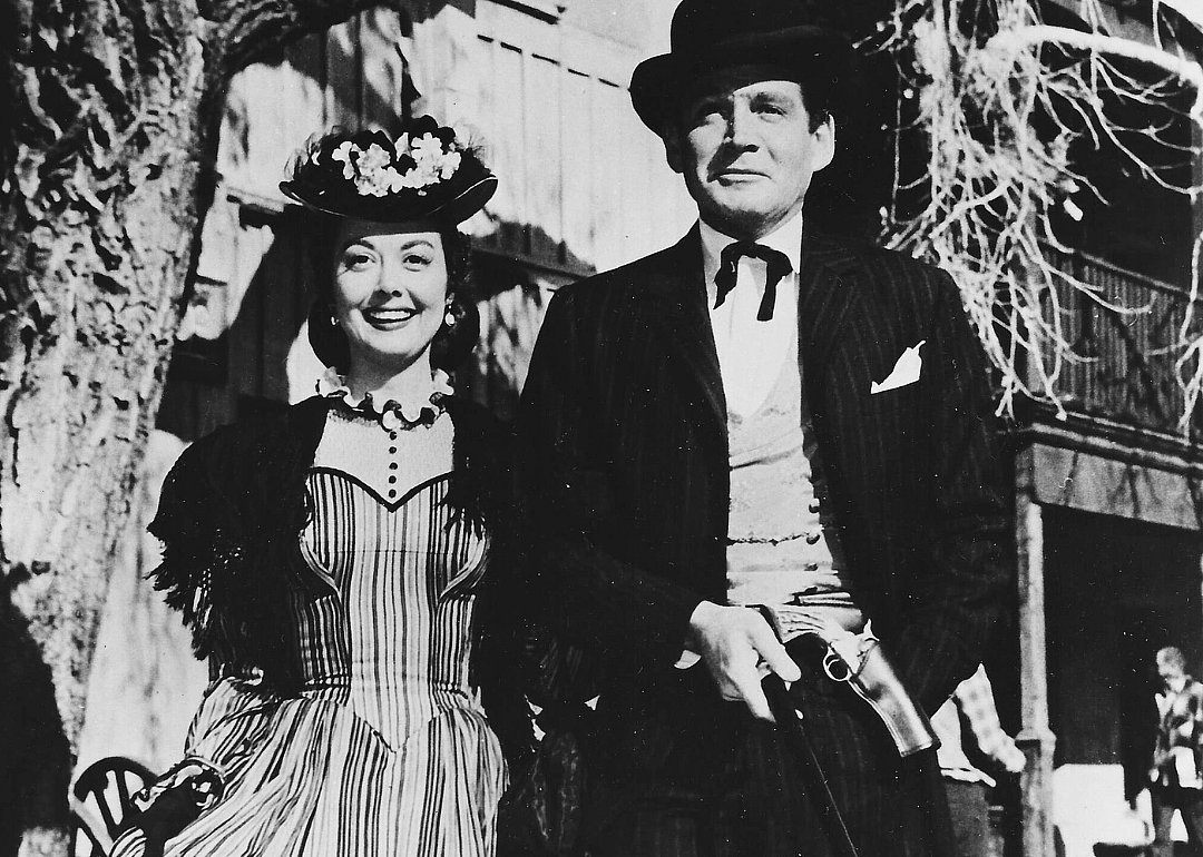 A man and woman dressed up in western wear.