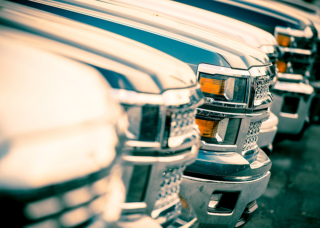 Close-up of a row of truck grills.