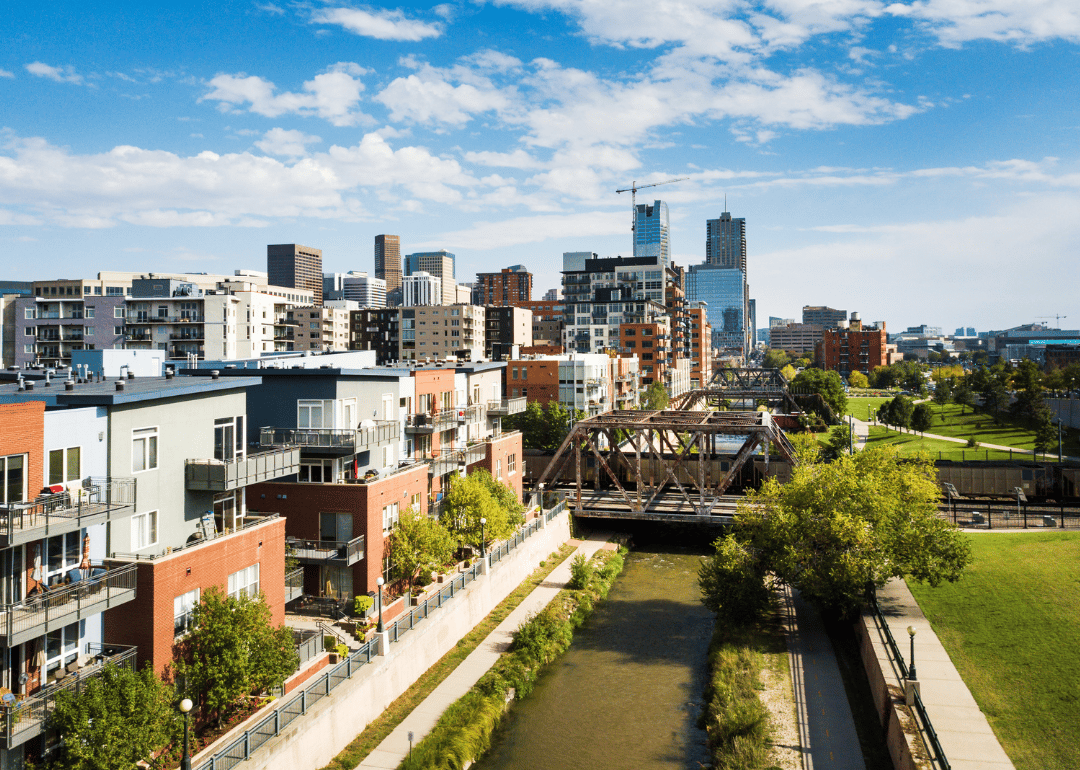 An aerial view of Denver with apartments by the river.