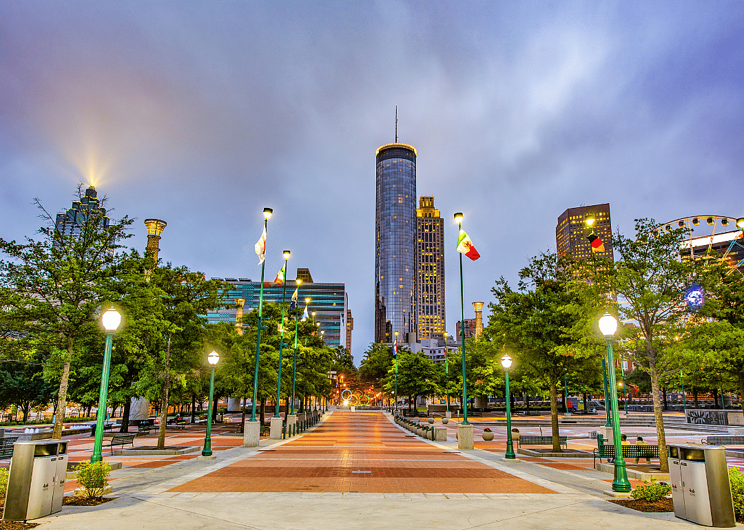 A downtown park with skyscrapers in the background.