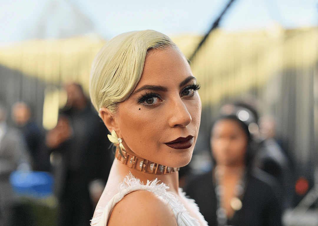 Lady Gaga in a gold choker necklace.