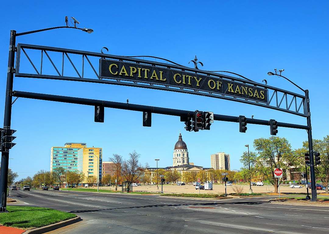 Entrance sign over the highway into Topeka.