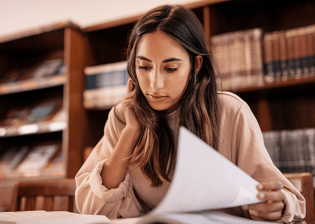 A college student studying in a library.