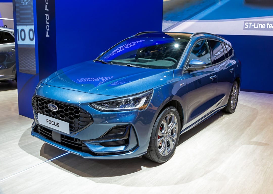 A blue Ford Focus in a showroom.