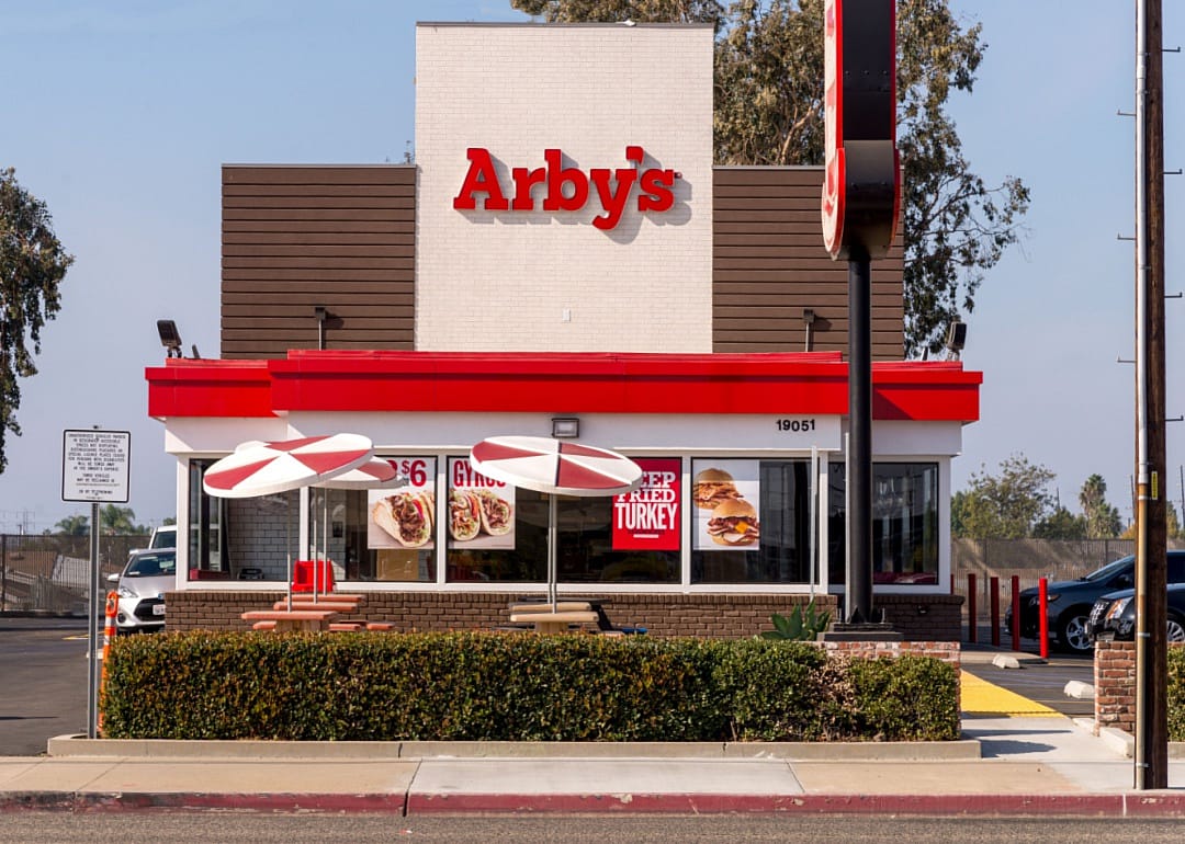 The red and white exterior of an Arby's restaurant.