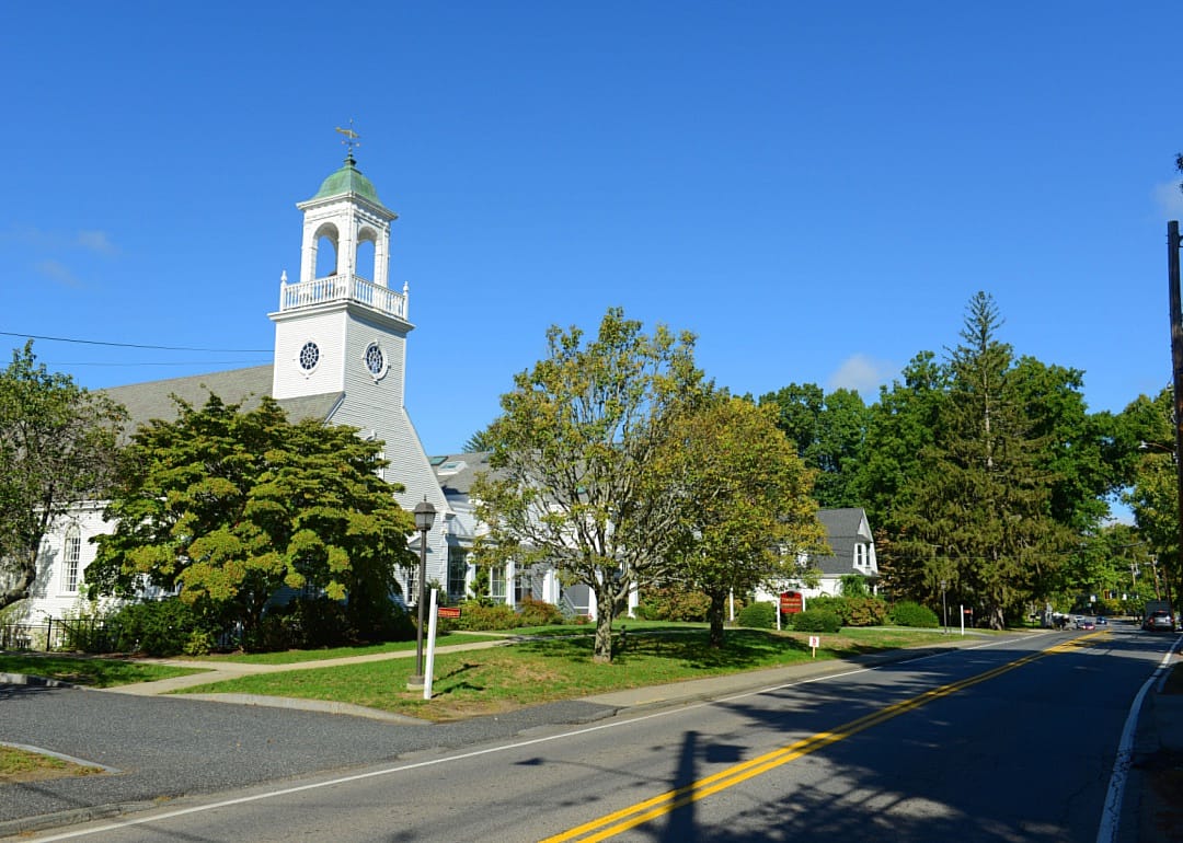 A small historic white church.