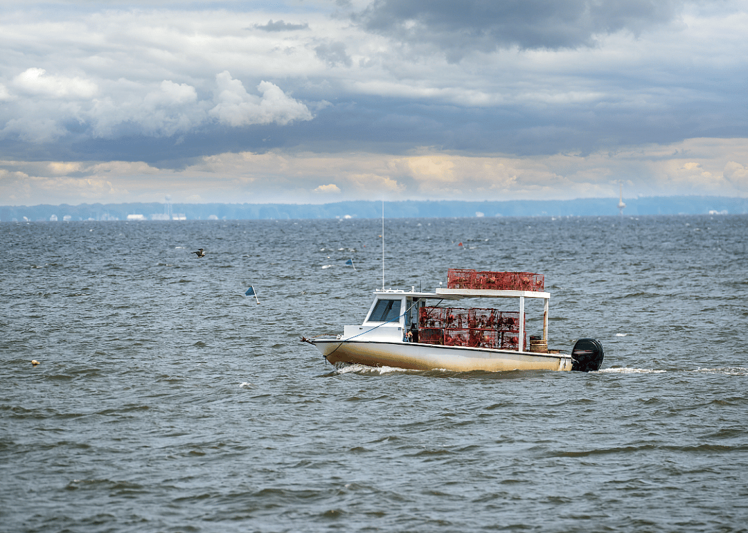 A rusty fishing boat in the open water. 