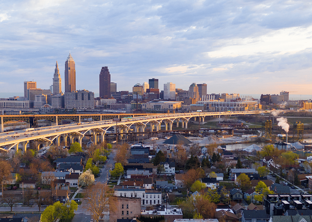 Aerial view of a highway running through Cleveland, OH and nearby homes.