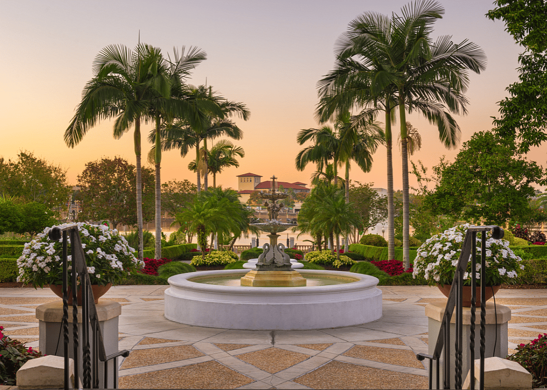 A beautiful stone terrace surrounded by gardens and water in Lakeland, Florida.