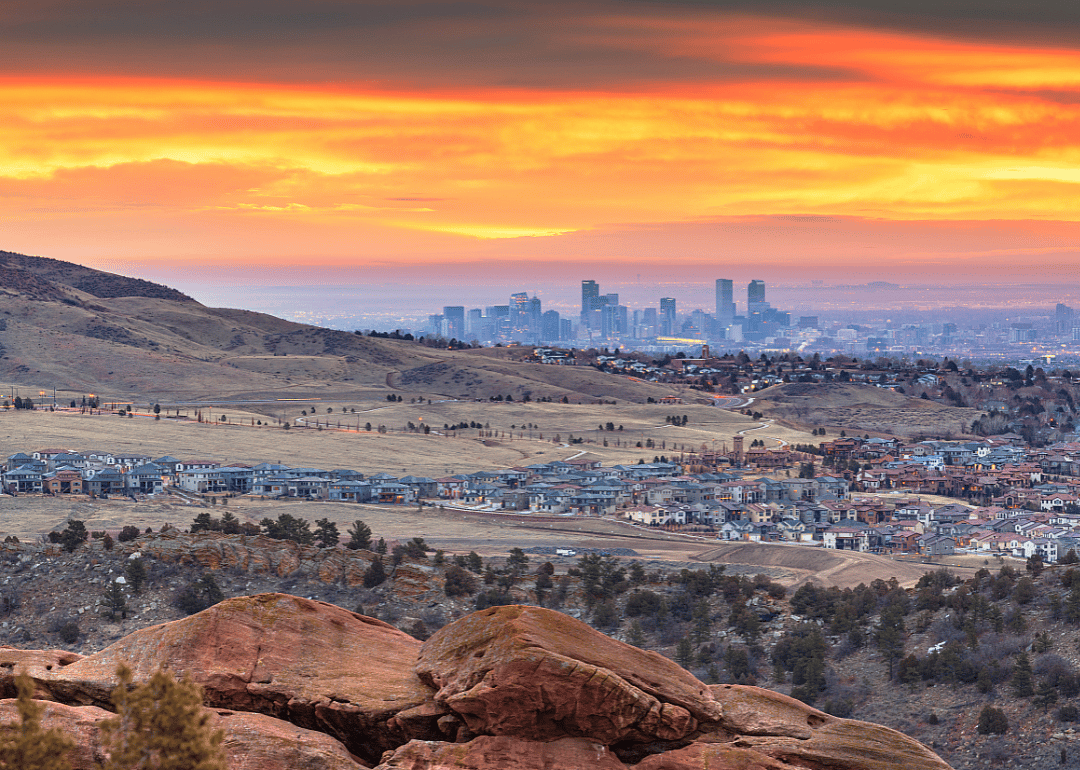 Homes in the foothills with Denver, Colorado downtown in the background.