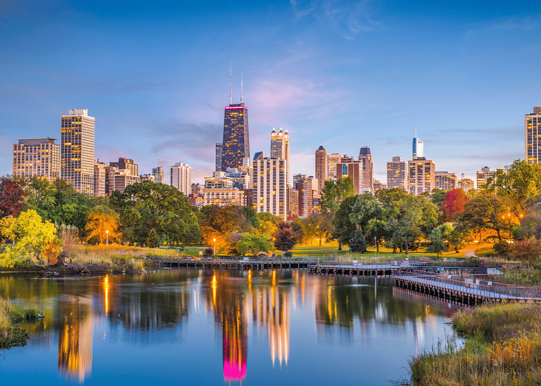 The Chicago skyline in the evening from a park.