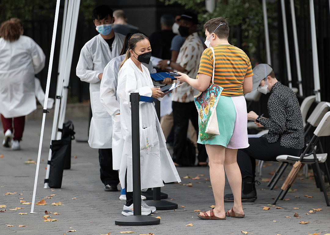 A person checking in to receive a vaccine.