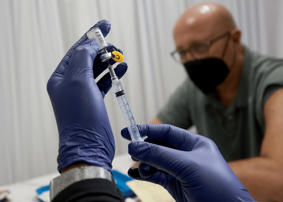 A healthcare worker prepares to administer a Monkeypox vaccine.
